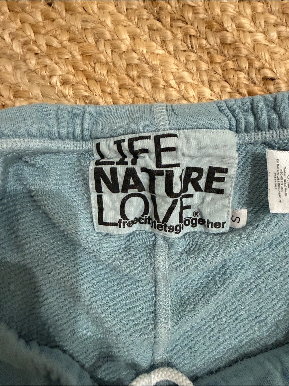 freecity Light Blue Kids Sweatpants with Teal Logo and Black Graphic - Picture 2 of 3
